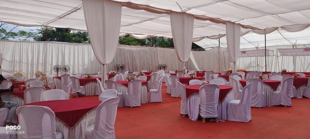 Banquet tables under a draped canopy at Raigad Agro Park