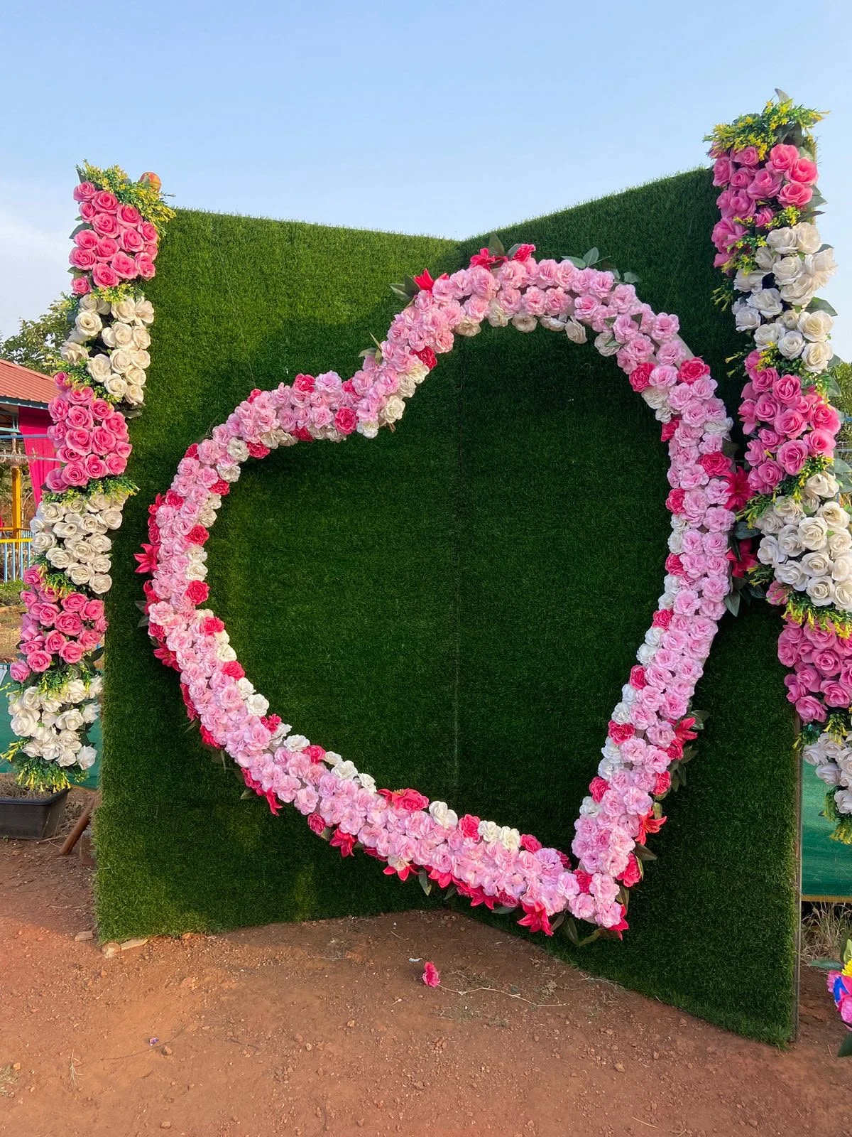 A floral heart backdrop at Raigad Agro Park