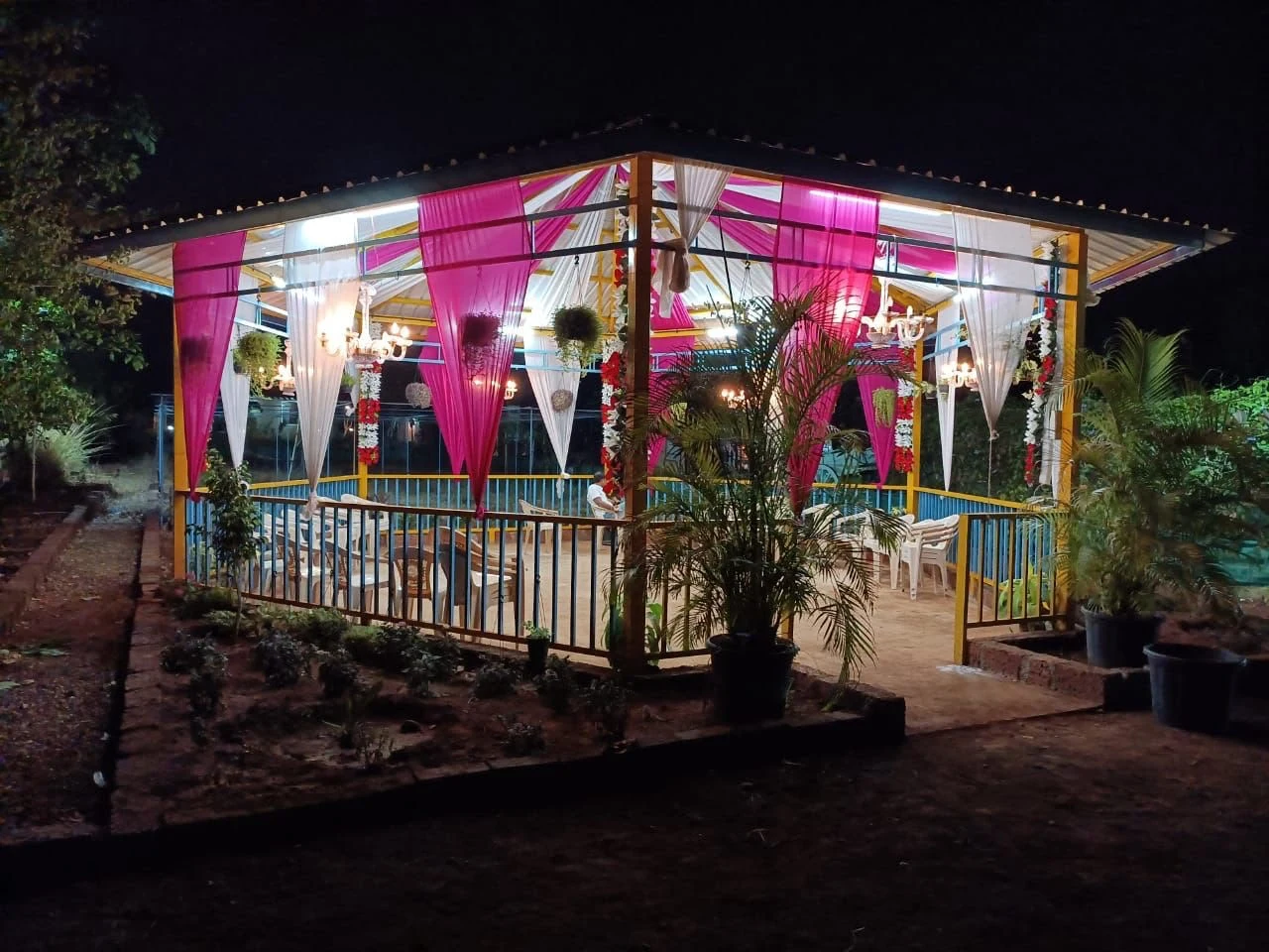 The gazebo lit for an evening celebration at Raigad Agro Park